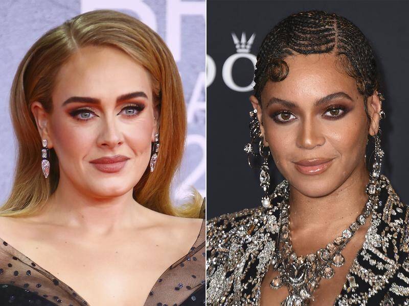 Adele, left, and Beyonce lead the nominees for the coveted album of the year trophy at the Grammys. (AP PHOTO)