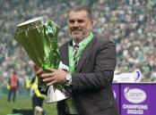 Celtic manager Ange Postecoglou celebrates with the Scottish Premiership trophy. (AP PHOTO)