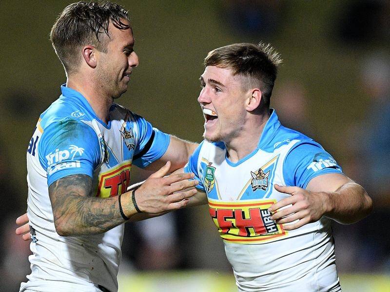 Gold Coast youngster AJ Brimson (R) is shaping a future fullback for the Titans, his coach says.