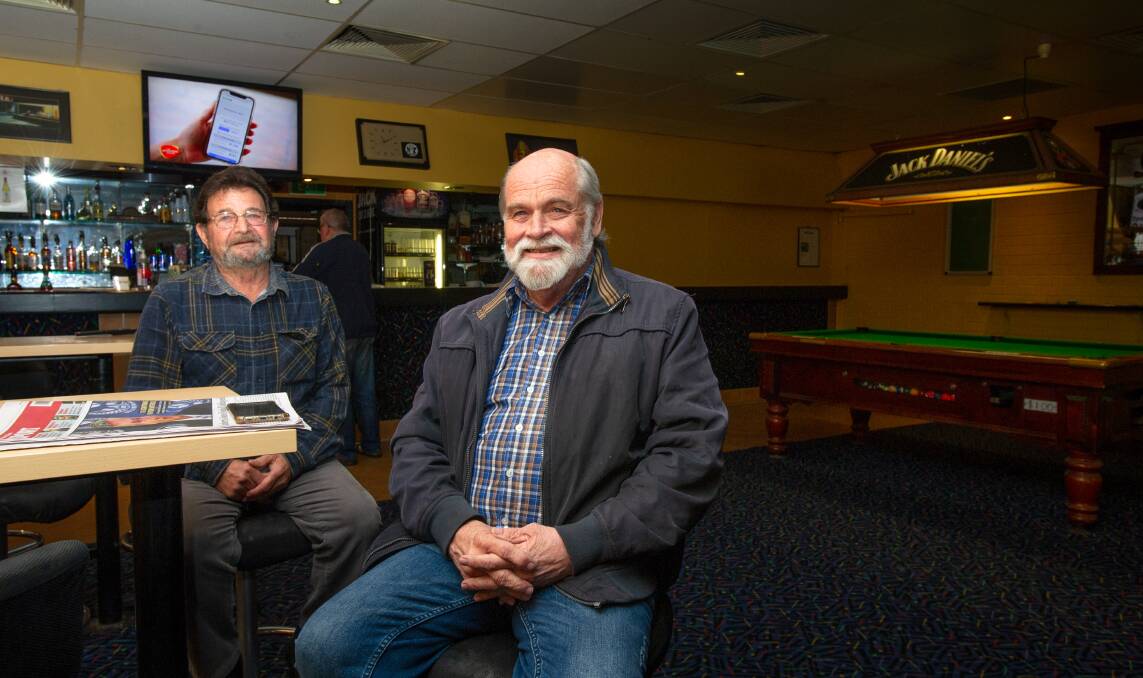 Chisholm Tavern regulars, Luis Villasevil and Ian Grant, are pleased the tavern has been saved from the building of a McDonald's on the site by the ACT government refusing to sell the public toilets. Picture: Elesa Kurtz