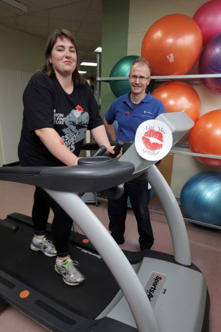 Multiple sclerosis sufferer Cindy Fulton clocks up the kilometres on the walking machine, watched by Lyndoch’s exercise physiologist Colin Wakely.  Picture: ROB GUNSTONE