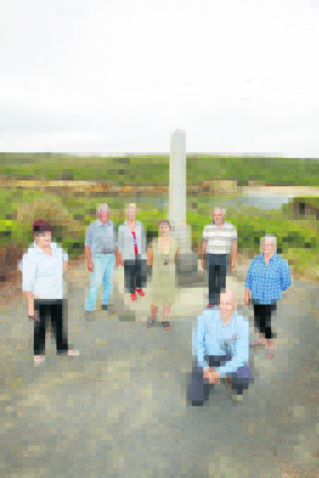 Port Campbell residents (from left) Lari Webber, Tom McKenzie, Margaret McKenzie, Marina Deppler, Leigh McKenzie, Josh McKenzie (front) and Bronwyn McKenzie have helped get the town’s war memorial restored in time for an offical unveiling the day before the centenary of Anzac Day.  Picture: ANGELA MILNE