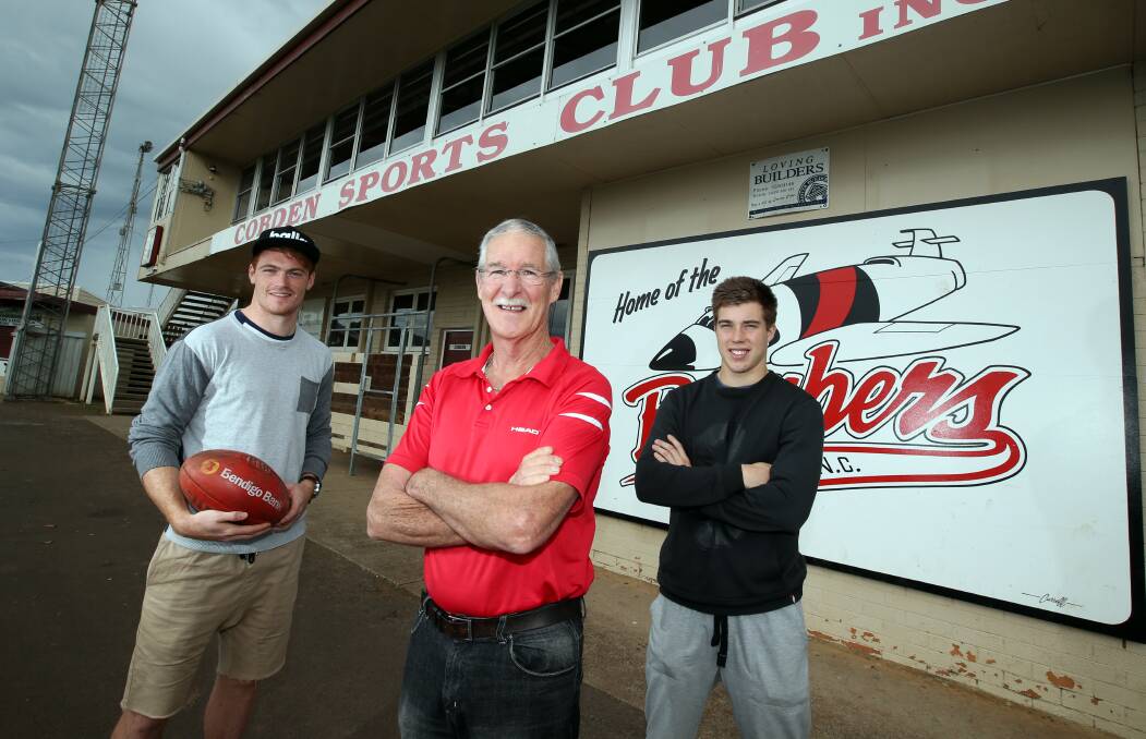 Former VFL/AFL player John Rantall (centre) with Swans player Gary Rohan (left) and Essendon's Zach Merrett at the Cobden football ground, where they all got their start.  Picture: DAMIAN WHITE
