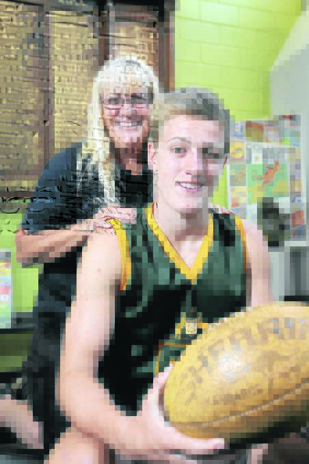 Proud mum Belinda Jarvis with her son and South Warrnambool footballer Kyden, 15, who has received a Local Sporting Champions grant.