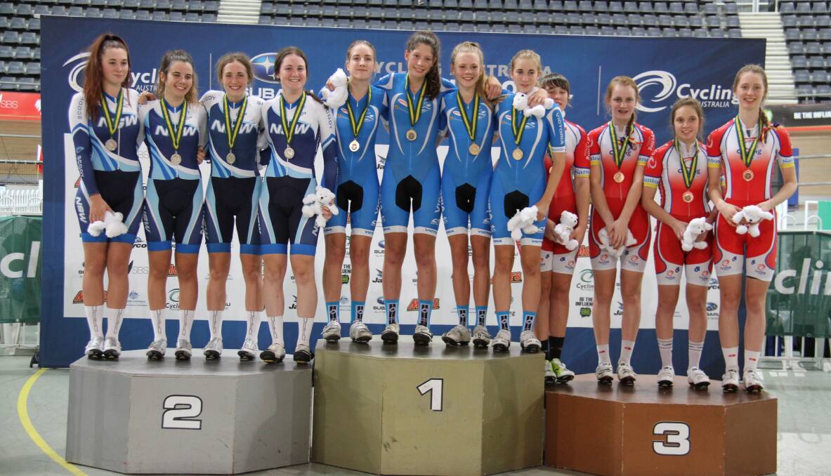 Warrnambool cyclist Ashleigh Hocking (in blue on the right) with teammates after the gold medal win. Picture: EPSOM ROAD STUDIOS