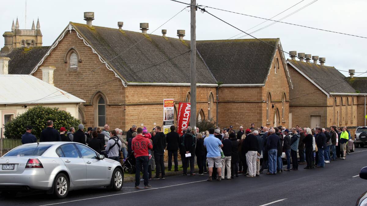 The auction of the bowls club site attracted a large crowd, with more than 120 people there to witness it being passed in. Picture: DAMIAN WHITE