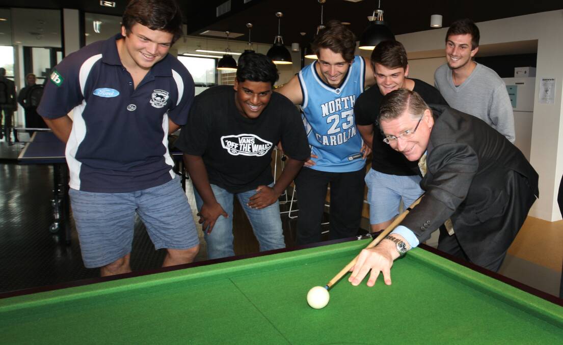After hustling up $2.5 million in state funding, Premier Denis Napthine gets a fun guide to Deakin University’s new accommodation centre with students Tim Wall (left), Aiden Koelmeyer, Jack Gardner, Daniel Down and Ben Watson.  