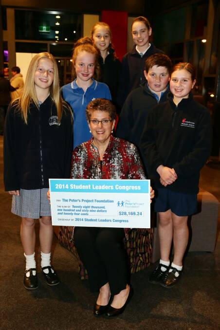 Pupils from Woodford and Woolsthorpe primary schools Olivia Dalton, 12 (left), Grace Robinson, 12, Takara Gorman, 10, Ella Titmus, 12, Baillie Keast, 12, and Sophie Lemke, 12, presented Vicki Jellie with a cheque for $28,169 at the Student Leaders Congress Night of Celebration. 140724LP31 Picture: LEANNE PICKETT