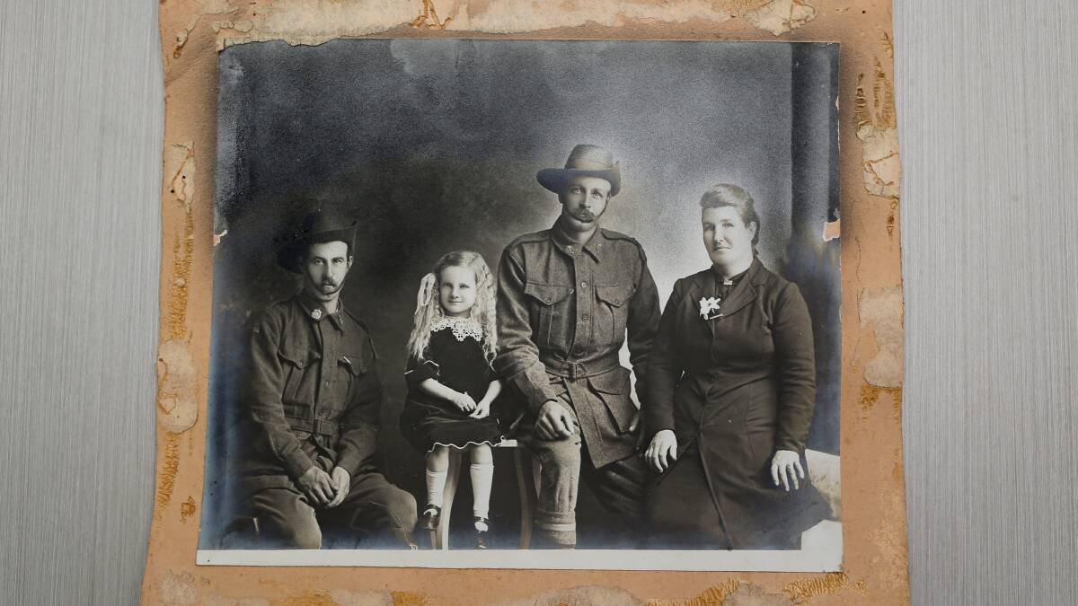 Taken by Camperdown photographer Walter Sheridan, the identities of these two World War I soldiers, the little girl and woman have been lost to history.