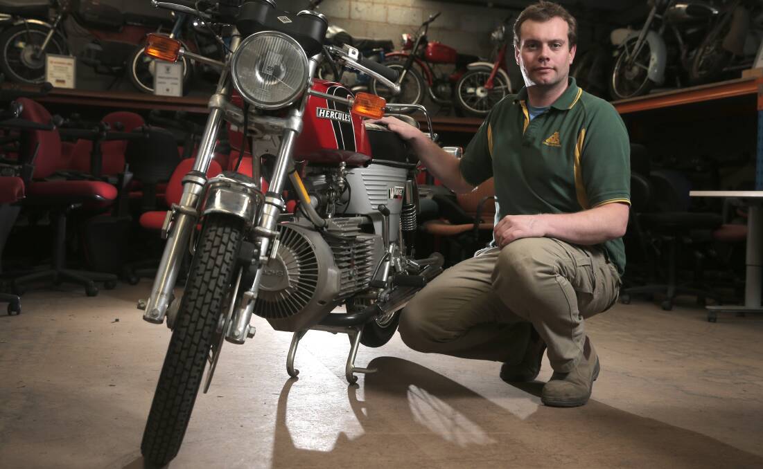 George Taylor Stores salesman Ed Bishop with the new motorbike in the museum collection, a 1975 rotary engine Hercules W2000. 