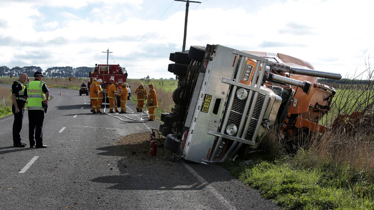 Police and emergency services at yesterday morning’s truck rollover north of Winslow. More than 50 sheep injured in the accident had to be destroyed by veterinarians. 
