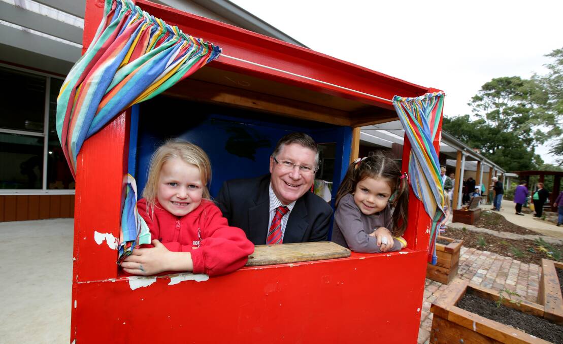 Premier Denis Napthine joins Kaitlyn Brown, 5, (left) and Sanura Iervasi, 4, at yesterday’s opening of the new $1.2million Koroit and District Kindergarten.