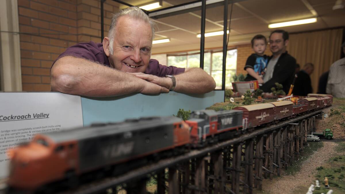 Kevin Bush, of Chewton, displays his Cockroach Valley trestle bridge model railway layout at the Archie Graham Community Centre on the weekend. 