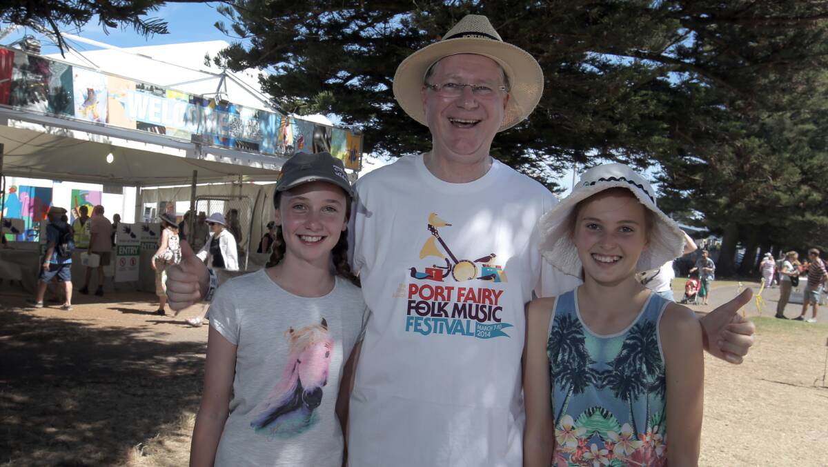 Victorian Premier Denis Napthine soaks up the festival atmosphere with 11-year-old Maudie Reading and 11-year-old Juliet Page.