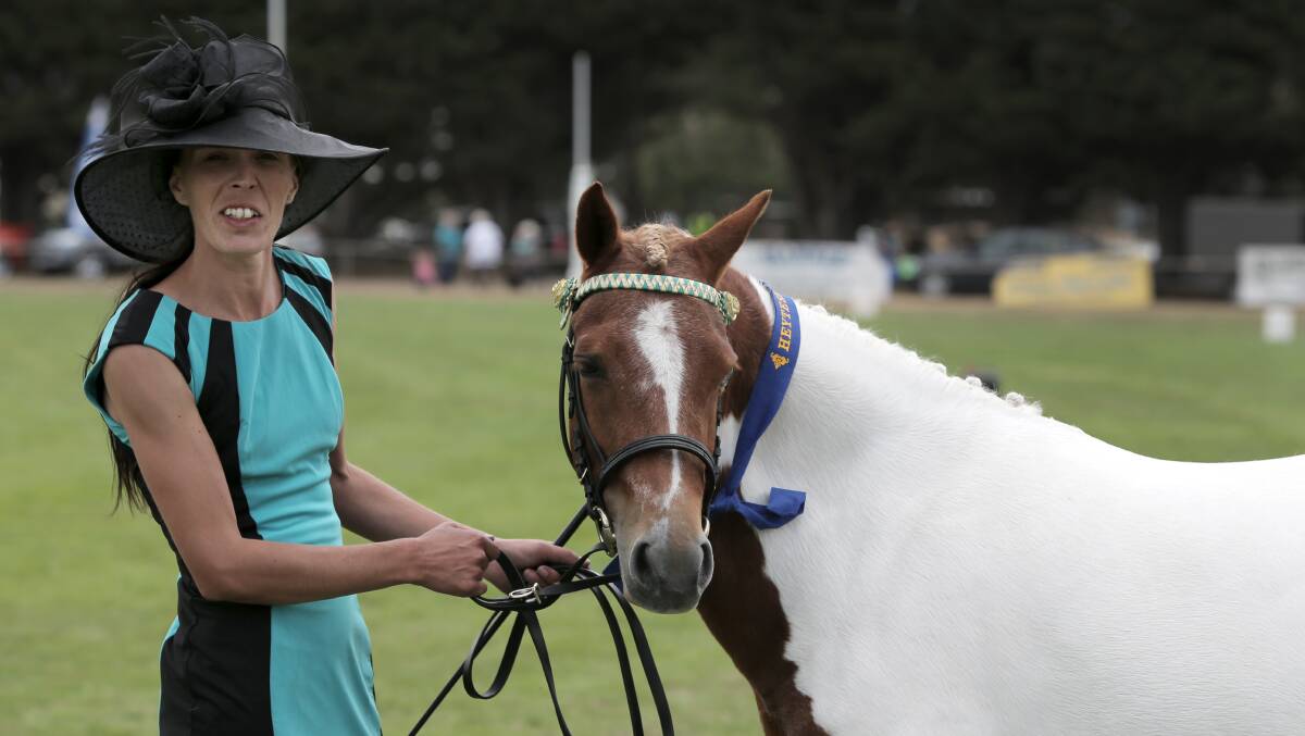 Krystal Bennett, of Colac, leads Mallawa Park La Bella to win the Champion ribbon in the Pinto 10.2-14 Hands catagory.