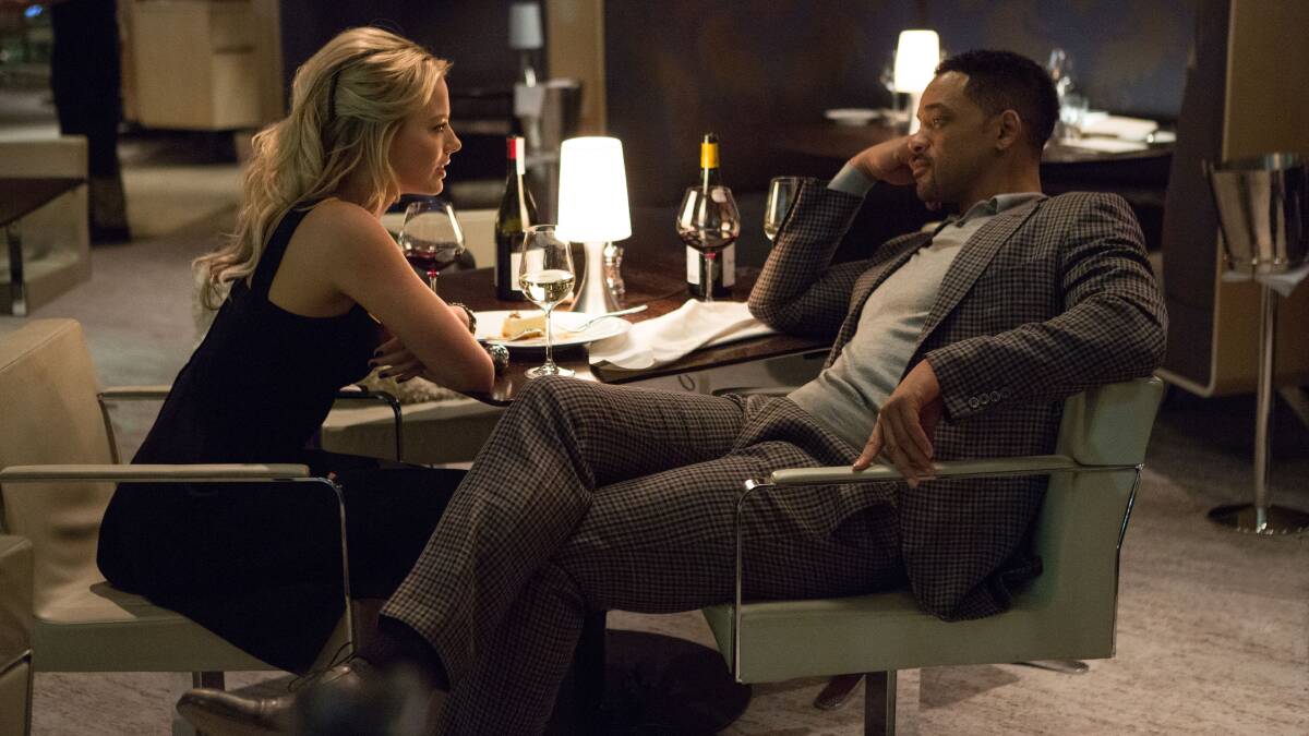 Australian actress Margot Robbie and Will Smith in a scene from Focus. 