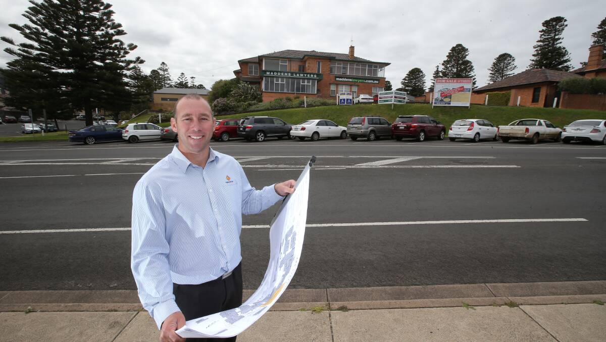 Fairbrother Constructions south-west manager  Billy Edis with plans for 20 millon dollar apartment redevelopment on Sandilands building site in Merri street Warrnambool.  Picture: DAMIAN WHITE 141015DW37