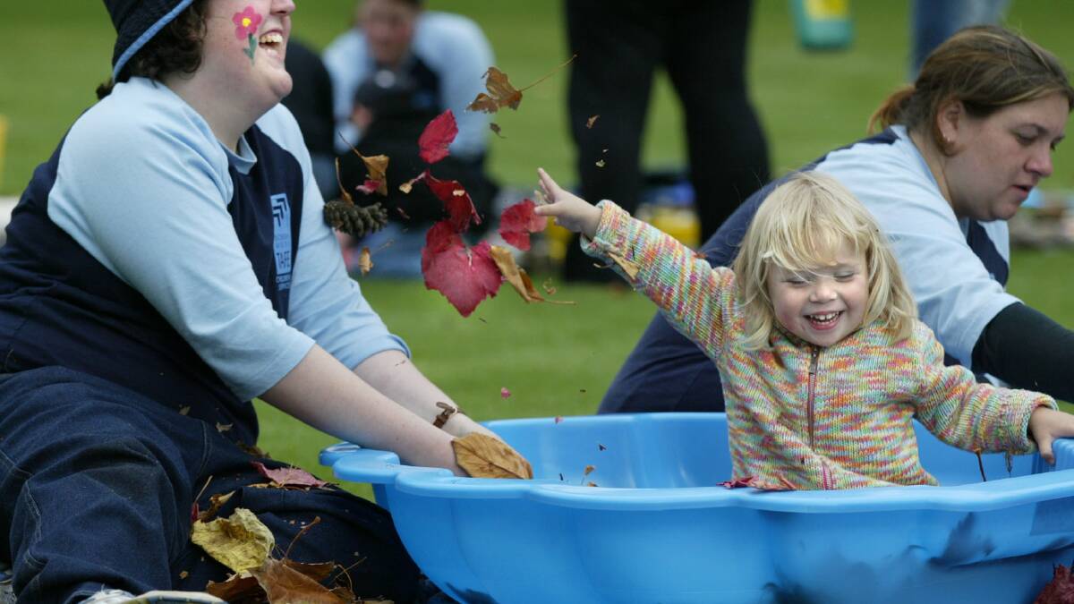 Children's services student Catherine White enjoys playing in the botanic gardens with Ella Crichton, 2. 