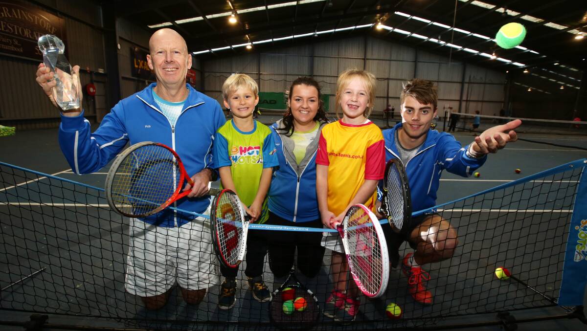 Hot shots: Warrnambool Indoor Tennis Centre owner Rob Urquhart (left), Myles Watson, 5, coach Paige Haberfield, Bella Dyson, 7, and coach Josh Hay share in the success of their state-recognised junior program. 140625DW10 Picture: DAMIAN WHITE