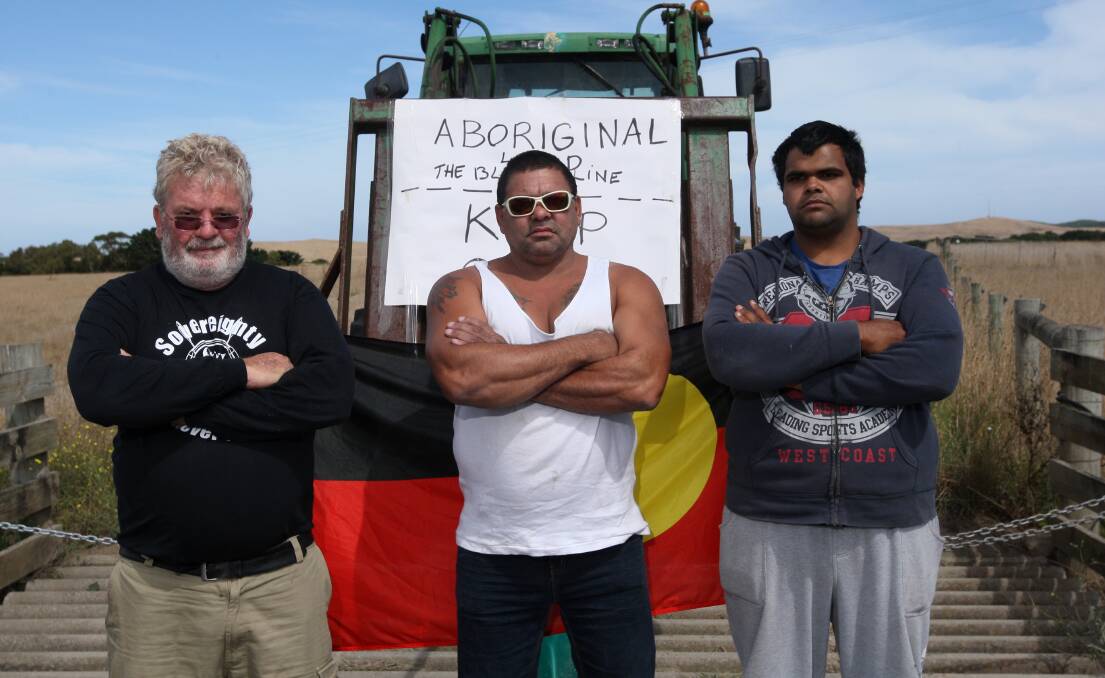 Aboriginal community members Geoff Clark (left), Phillip Chatfield and Billy McGuinness staged a protest at the entrance of the Boona Pastoral Company dairy farm east of Yambuk yesterday. 