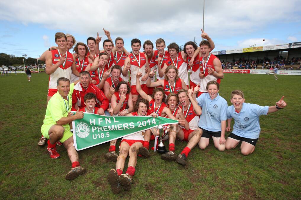 South Warrnambool under 18½ players celebrate a rare achievement, progressing from an elimination final to claim their premiership pennant. 140920AS03 Picture: AARON SAWALL
