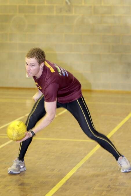 Matthew McMillan fires out a handpass during a South Rovers indoor training session this week. After a wintry round last weekend, it would have been a welcome change of routine.140701RG57 Picture: ROB GUNSTONE