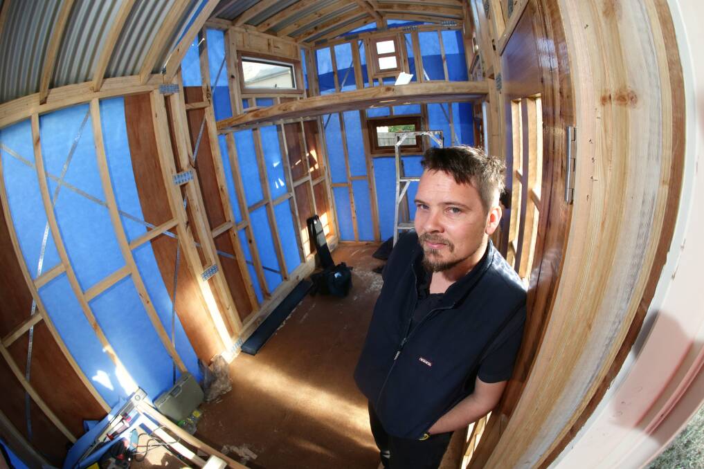 Regan Barker’s Tiny House is gradually taking shape in the yard of his father’s Jamieson Street home. 140730AS04 Picture: AARON SAWALL