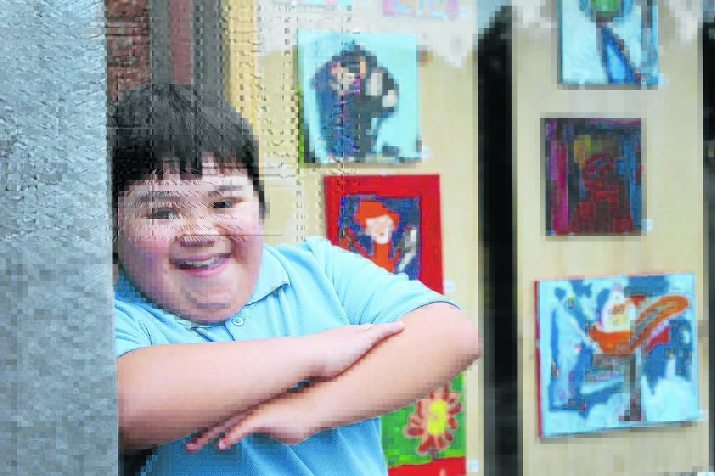 Young Warrnambool artist Alexander Annett, 12, will display his artworks in an exhibition titled Captain Haddock at Red Hart Studios which will run until the end of February. 150211AS20 Picture: AARON SAWALL