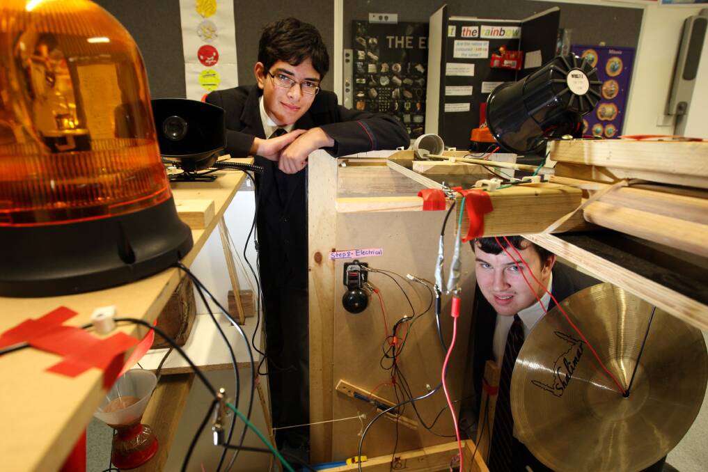 Emmanuel College students Jed Gleeson (left), 15, and Martin Eccles, 17, with the Wake Up Machine which won an award from the University of Melbourne.
