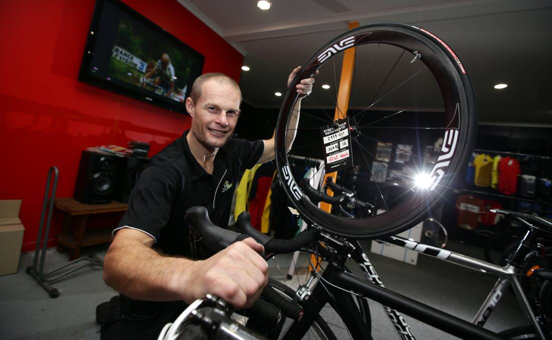Crankhouse salesman Darren Harris is wheely hooked on the Tour de France. 140709DW50 Picture: DAMIAN WHITE