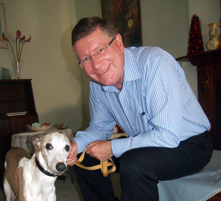 Premier Denis Napthine gets acquainted with his new whippet Liam.