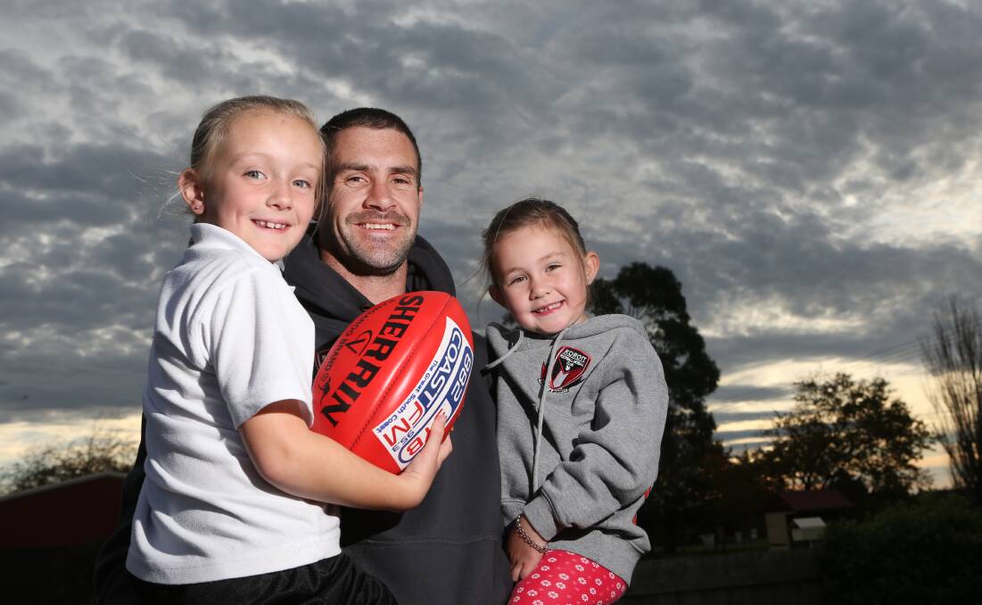 Family fun: Koroit football stalwart Chris McLaren with his daughters Molly, 7, and Lucy, 5. 