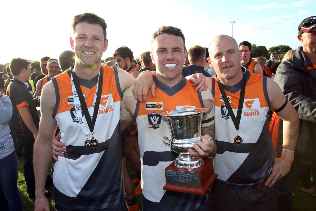Dartmoor players Chris Lenehan (left), Justin Lynch and Vincent Ryan bask in the glory of a premiership. 140913DW07 Picture: DAMIAN WHITE