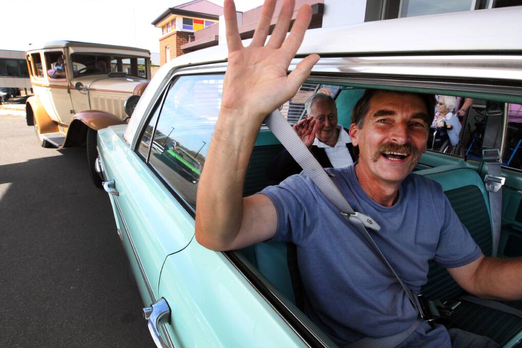 Warrnambool and District Historical Vehicle Club member Ian Rees takes Father John Murphy for a spin in his 1963 Rambler Classic during the club’s visit to Mercy Place nursing home last week. 