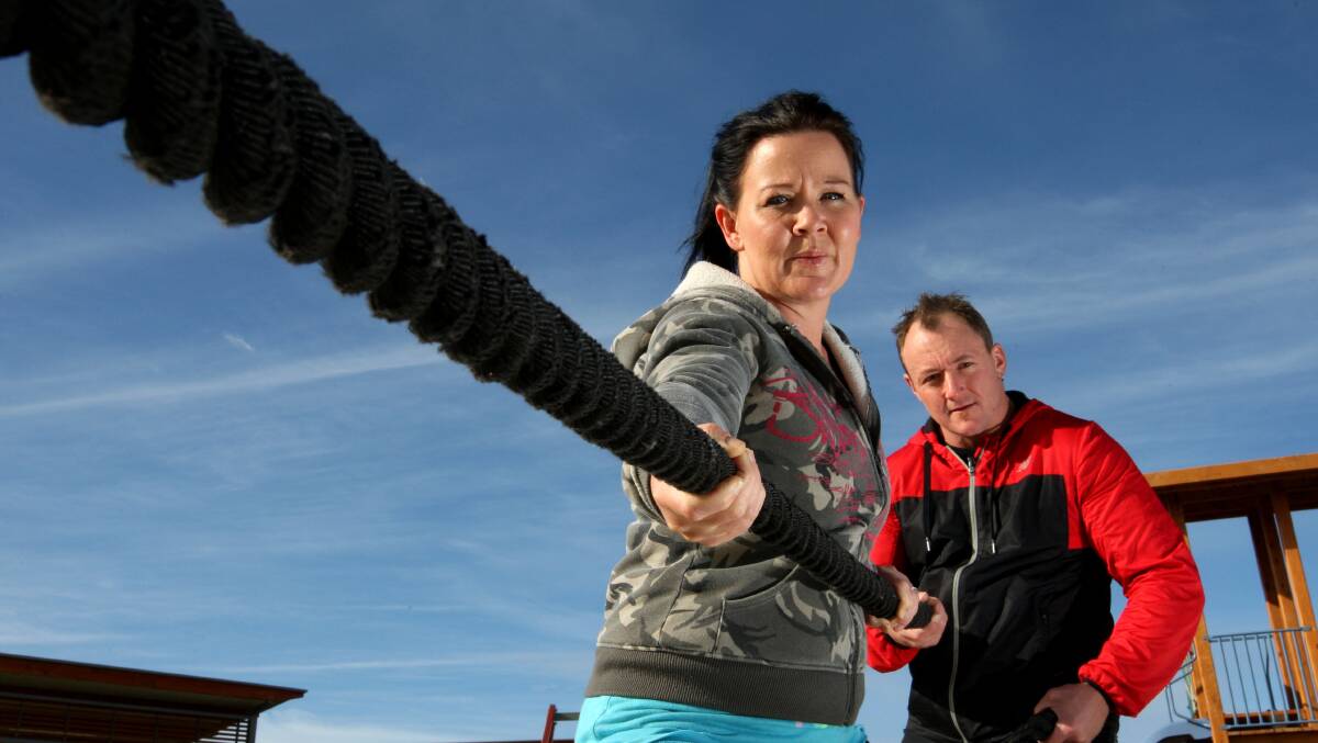 Personal trainers Mel and Scott O’Keefe prepare for tomorrow’s boot camp in aid of Bryn Murfett. 