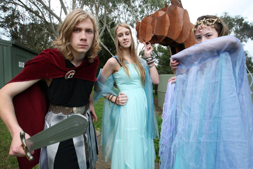Hawkesdale P-12 students Jobe Hollard, 16 (left), as Menelaus, Elektra Scholz, 16, as Helen, and Belinda Amess, 18, as Aphrodite, get in character for the college’s play Helen Of Troy. 140901LP02  Picture: LEANNE PICKETT