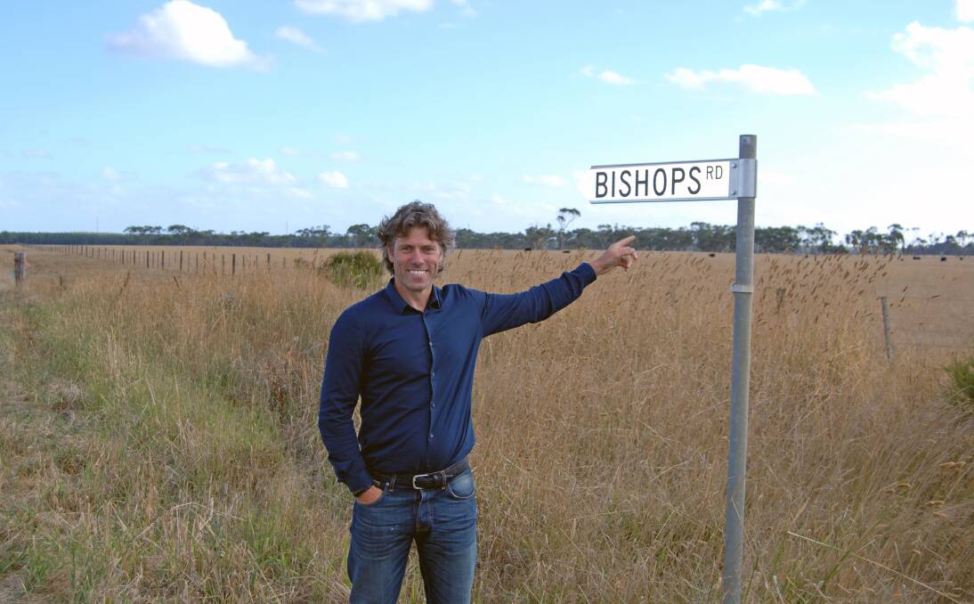 British comedian John Bishop points out the new sign marking the road named after his family in Bessiebelle.