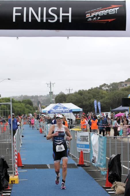 Olyfest female winner Jillian McKenzie crosses the finish line. 