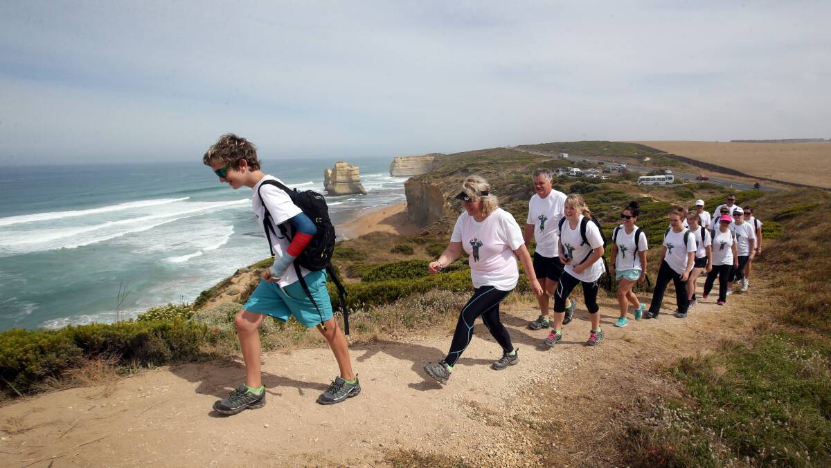 Against the spectacular backdrop of Gibson Steps beach, Billy Heard, 12, takes his turn to lead his parents Murray and Nicol Heard, sister Haylee, 13, and supporters on the 100km Paddy’s Courage trek from the Twelve Apostles to Apollo Bay to raise awareness about organ donation. 