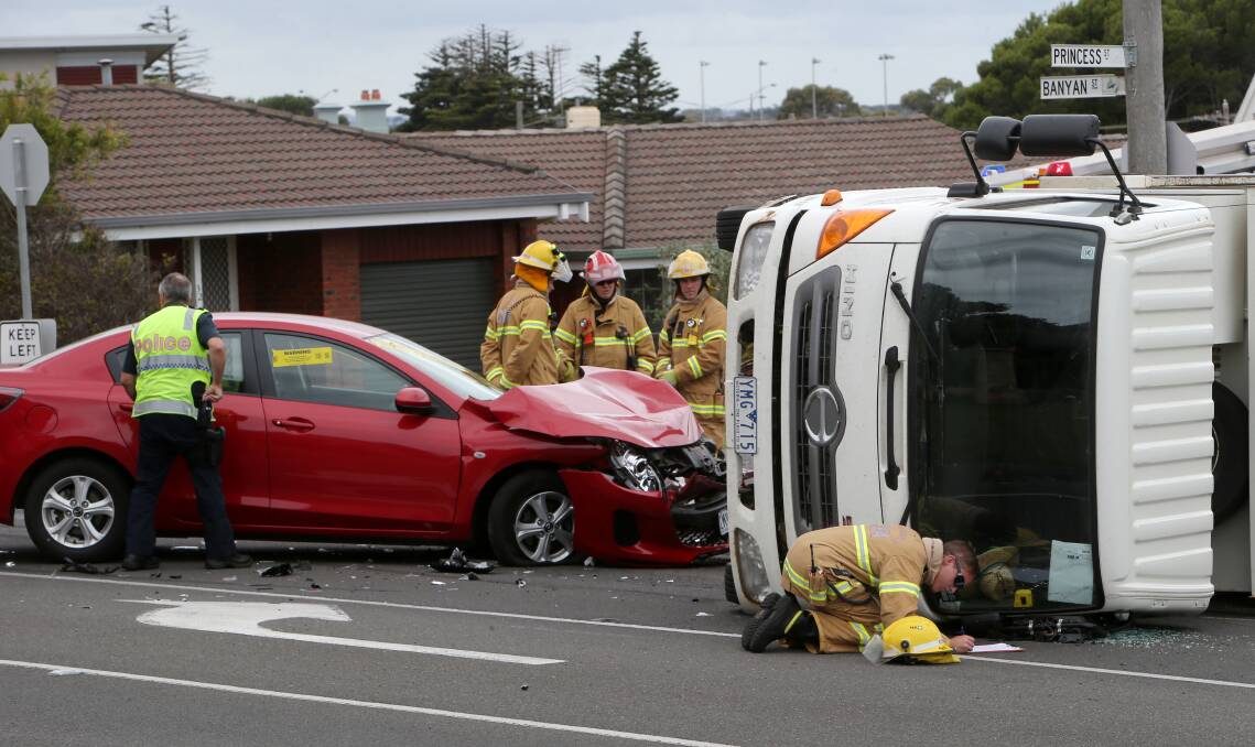 Police and CFA members attend yesterday's crash at the corner of Banyan and Princess streets. 150127AS10 Picture: AARON SAWALL