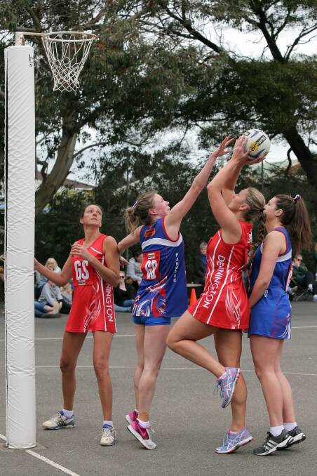 Dennington’s Kate Burt puts up a shot, with pressure from Panmure’s Sally O’Keefe (left) and Maddi White. 140816RG20 