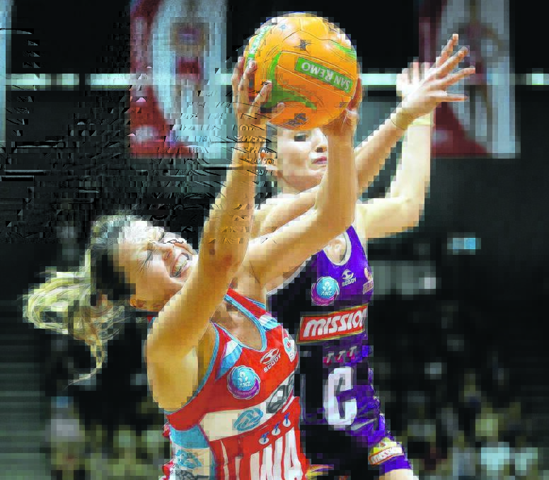 Sarah Wall grabs possession during last week’s match with the NSW Swifts.