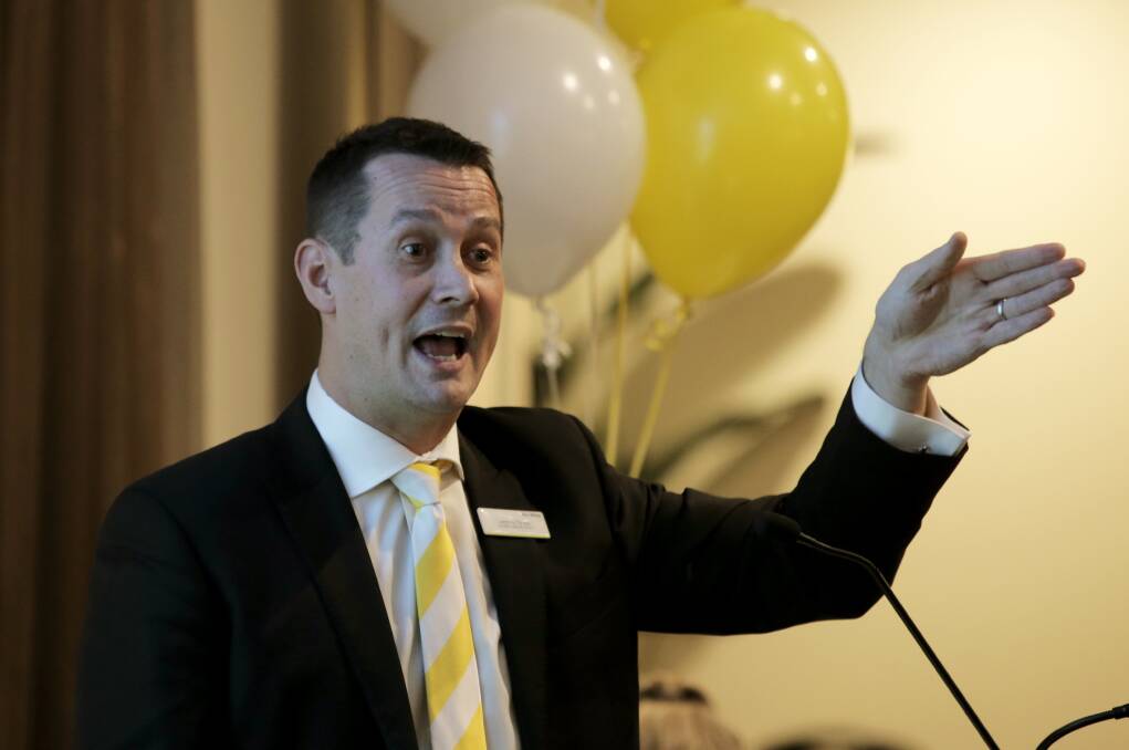 Ray White Real Estate auctioneer Jeremy Tyrell takes bids at this week’s auction held at the Mid City Motel. 