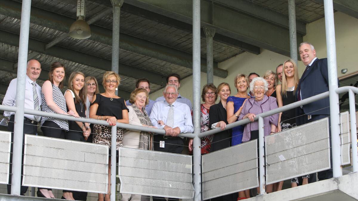 Rose Primmer (fifth from left) celebrates the news that the Warrnambool Racing Club has named a race after her late husband Mark with immediate family and friends at the Warrnambool racecourse.   