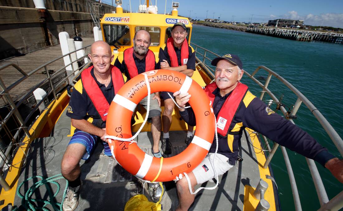 Warrnambool Coast Guard flotilla members David Francis (left), Neil Sloan, Keith Prest and Mike Vafiades prepare to head out on a training run from the Lady Bay breakwater. 