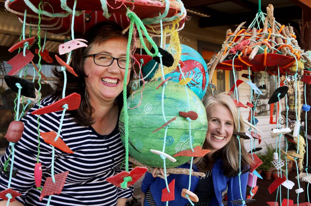 Artists Rachel Peters (left) and Shelley Knoll-Miller prepare for this weekend’s oceanic-themed laneway festival finale. 140512LP16 Picture: LEANNE PICKETT