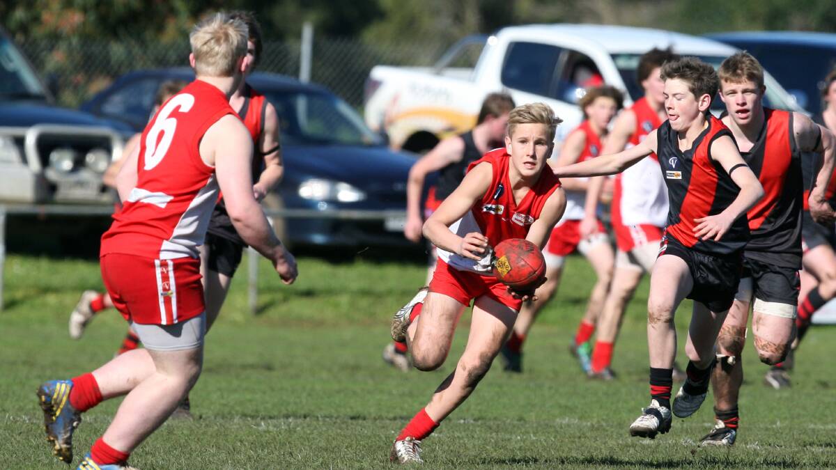 South Warrnambool’s Isaac Harris is pursued by Cobden’s Shaun Drayton in their Under 16 clash last Saturday. 40803LP59 Picture: LEANNE PICKETT