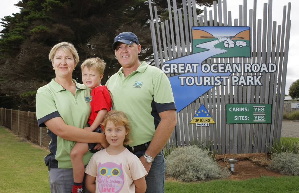 Award-winning tourist park operators Sarah and Dean Hellessey with their children Toby and Lily. 