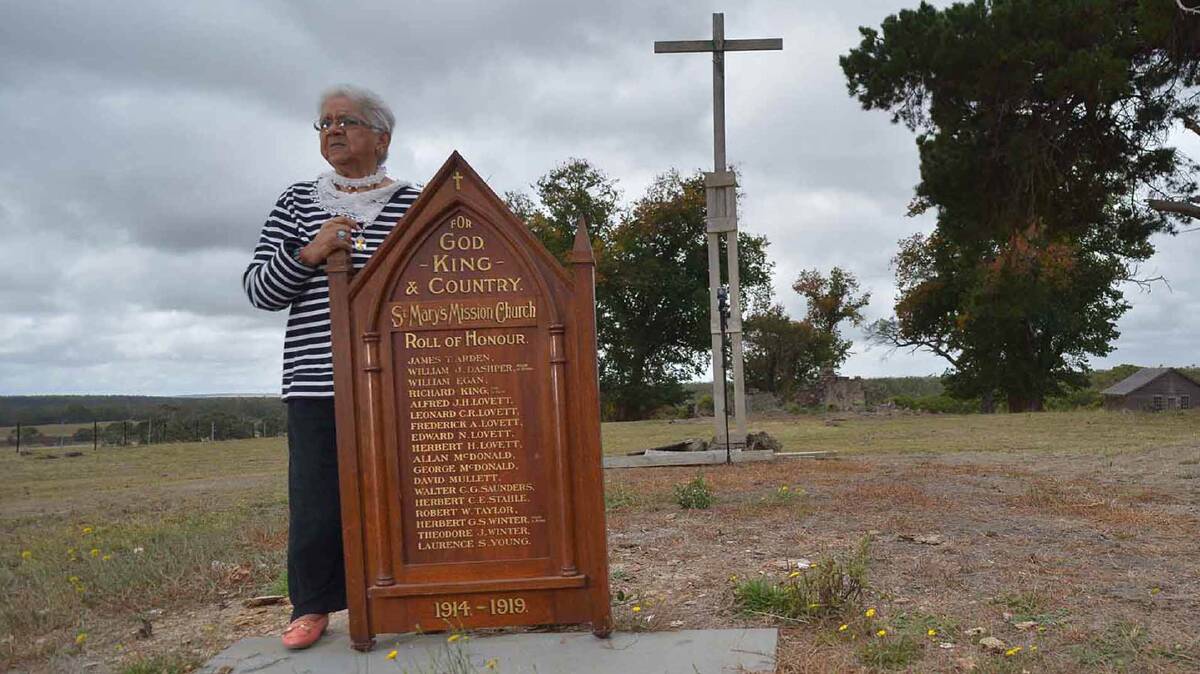 Laura Bell, Frederick Lovett’s daughter, with the St Mary’s Mission church Roll of Honour at the ruins of the Aboriginal mission station at Lake Condah, where the five Lovett brothers lived after returning from WWI.  Picture: THE AGE