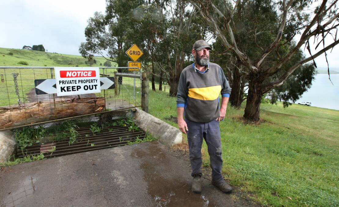 Willie Hawker with the closed gate to his property at Lake Bullen Merri. There is a campaign to have the road reopened.
 111103LP03 Picture: LEANNE PICKETT